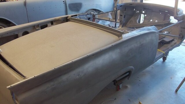 Classic car body restoration in progress.
