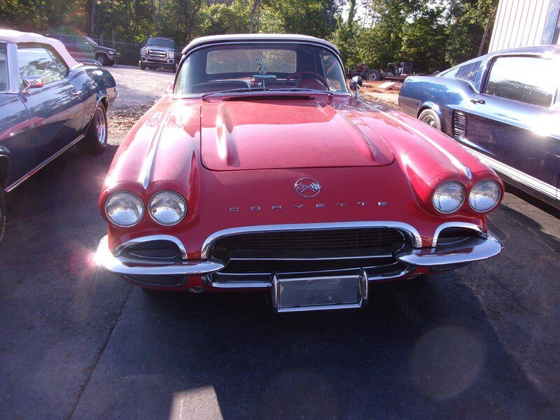 Front grille and quad headlights of red Corvette