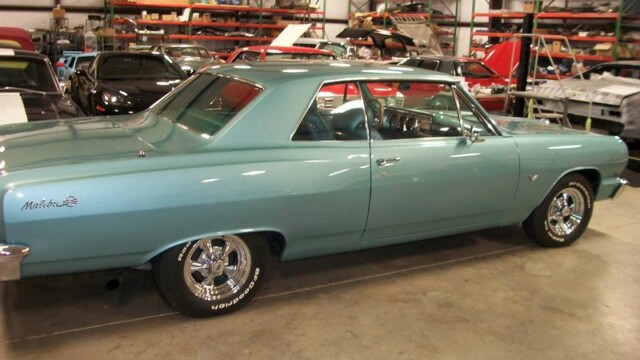 Light blue 1965 Chevy Malibu coupe.