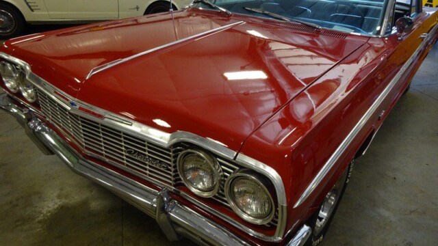 Red classic Chevrolet Impala car.