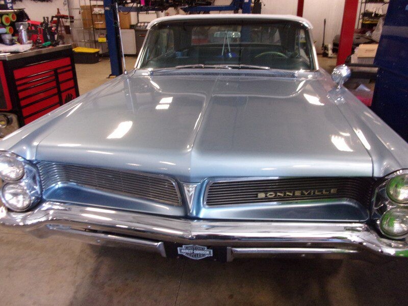 Silver Pontiac Bonneville convertible.