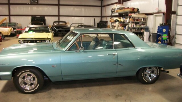 Light blue classic Chevrolet Malibu coupe.