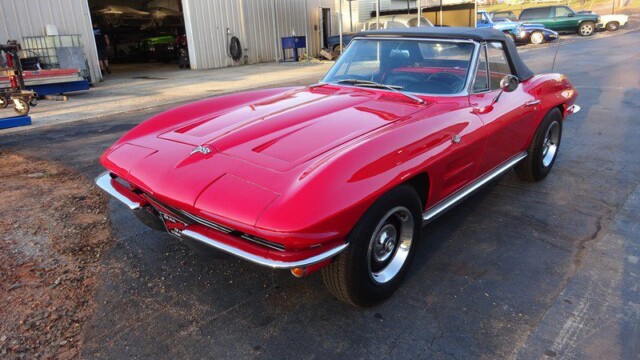 Three-quarter front view of red Corvette convertible