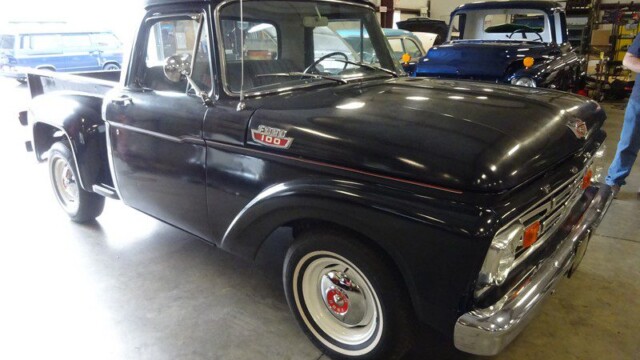 Black Ford 100 pickup truck.