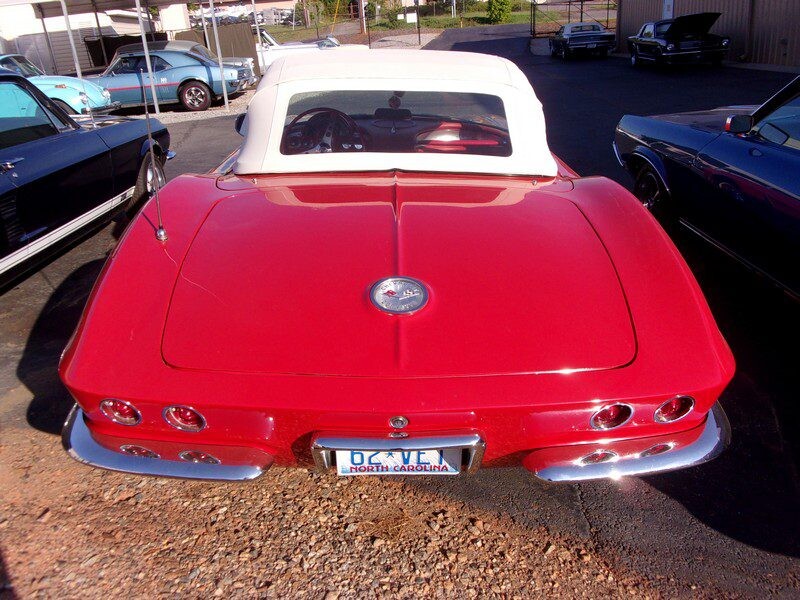 Red Corvette convertible, North Carolina plate.