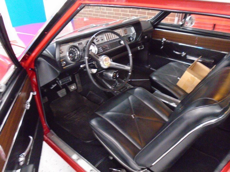 Red Oldsmobile Cutlass interior.