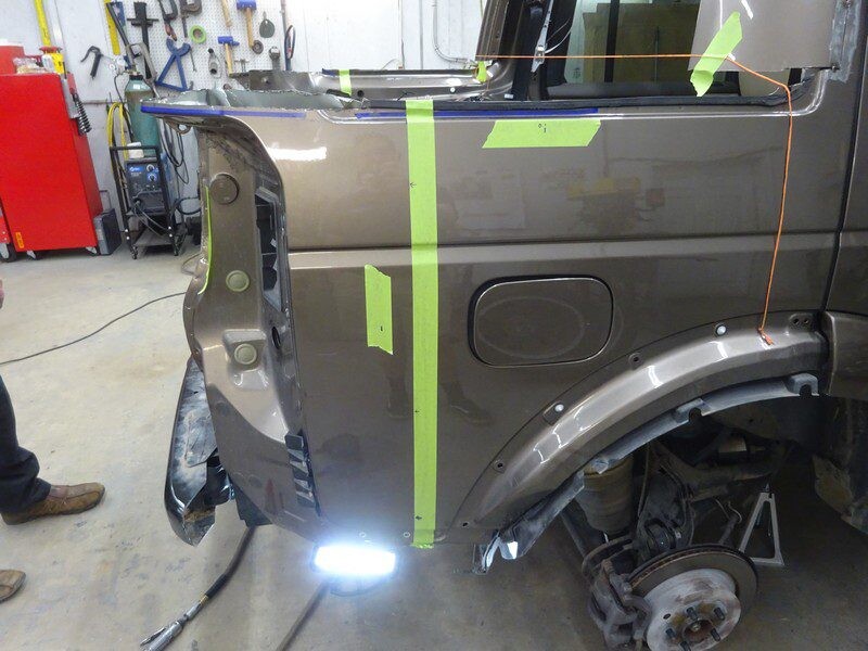 Brown Land Rover body repair in progress.