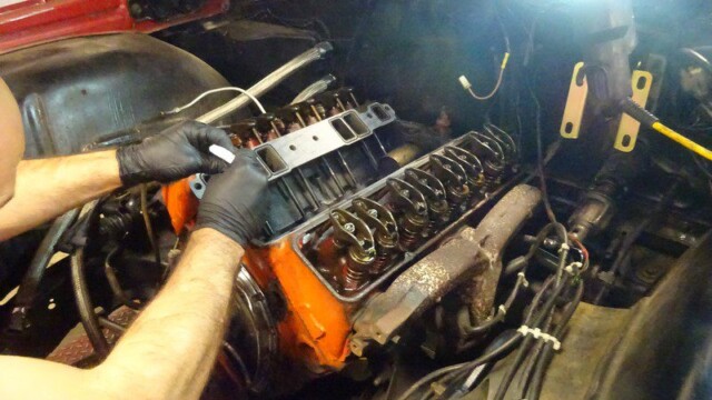 Mechanic repairing a car engine.