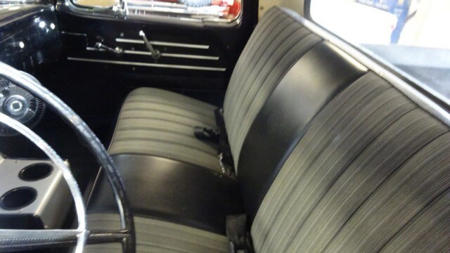 Classic truck's interior, black and gray seats.