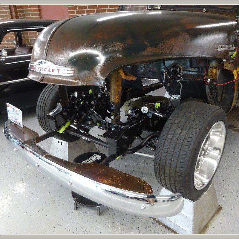 Rusty Chevrolet truck under restoration.