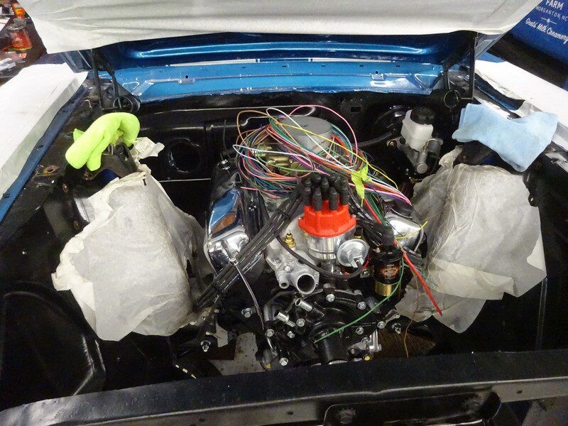 Rebuilt engine with colorful wiring and red distributor