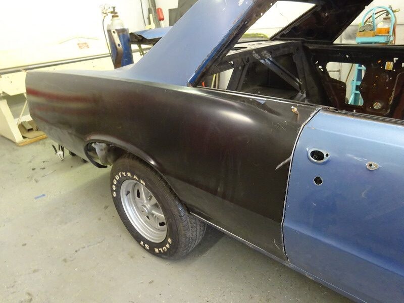 Classic car body repair in progress.