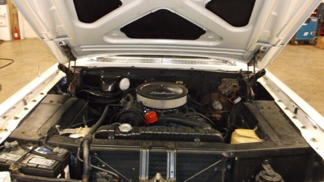 White classic engine with Edelbrock air filter