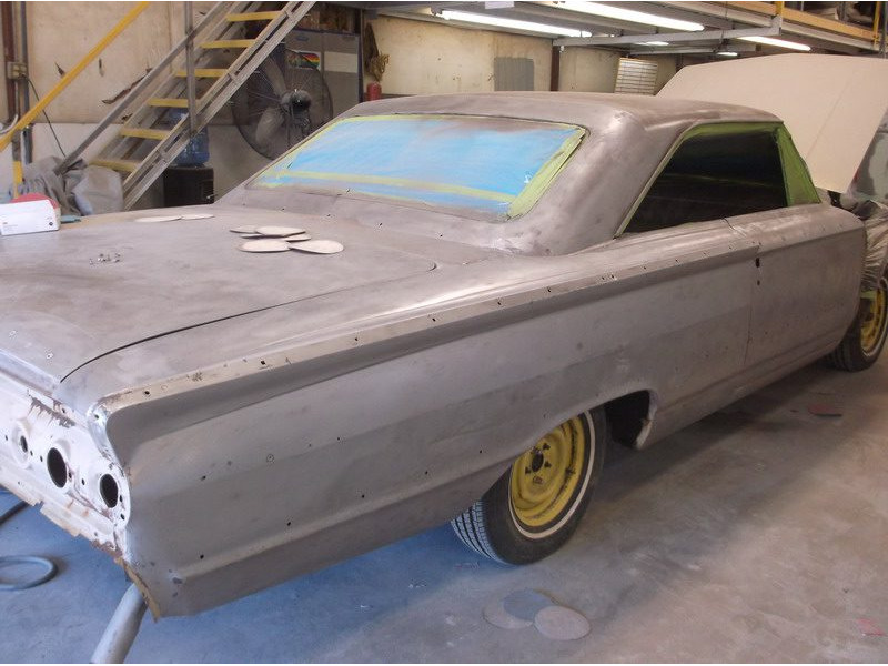 Here's an alt tag for the image: `Classic car body in progress`