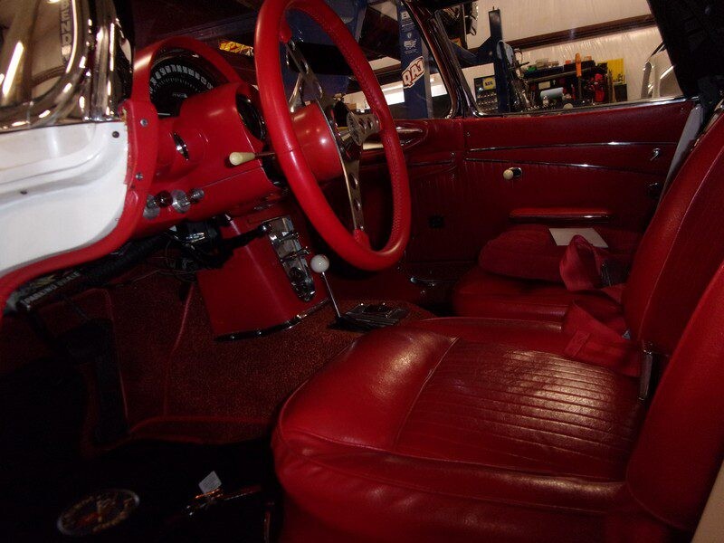 Deep red Corvette interior with white shift knob