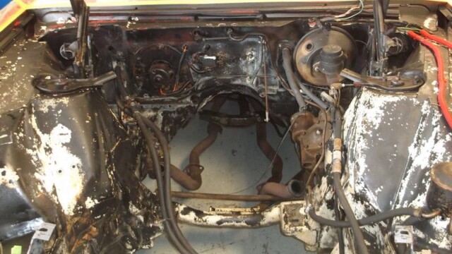 Classic car engine bay restoration project.