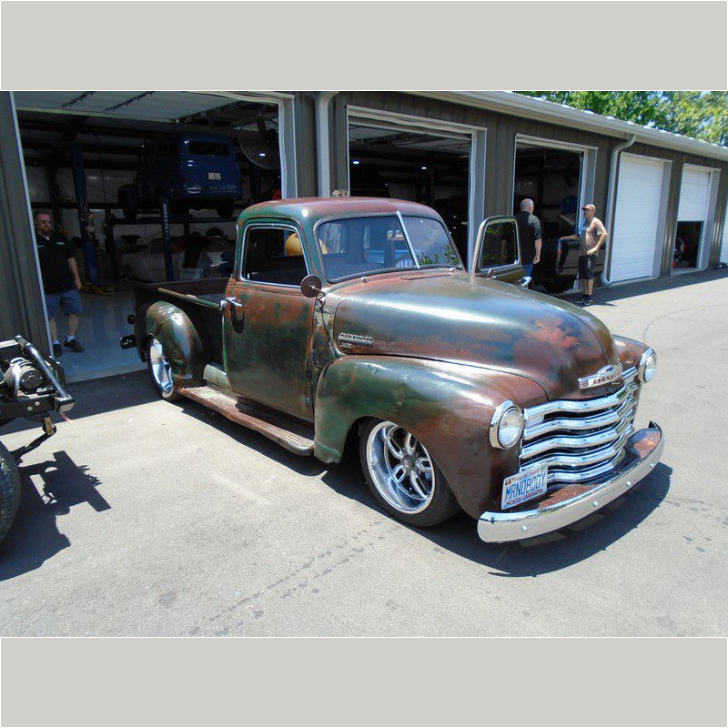 Rustic green Chevrolet pickup truck.