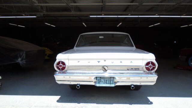 White Ford Futura in a garage.