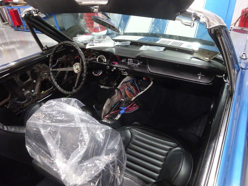 Blue Ford Mustang convertible interior, under restoration.