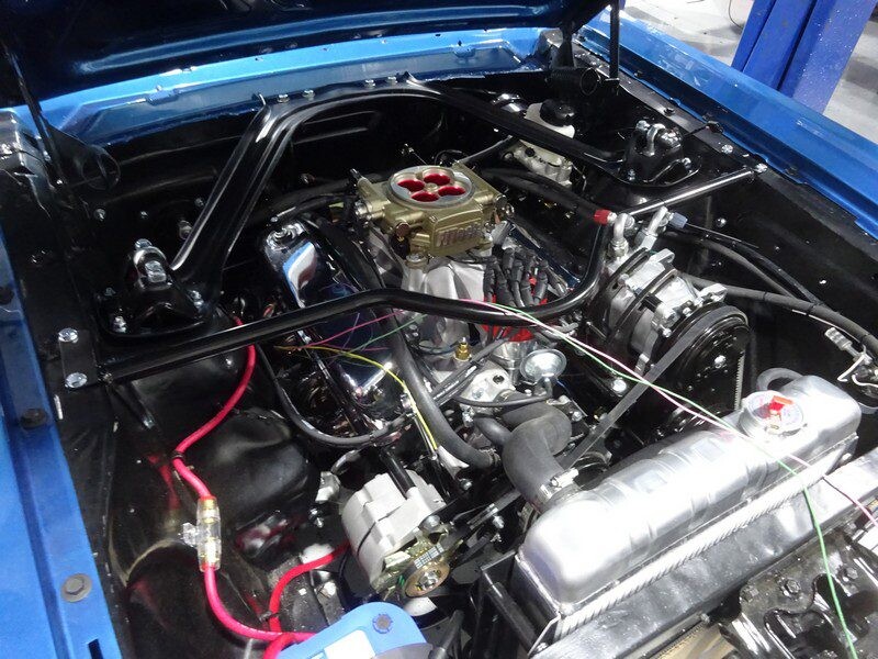 High-performance carbureted Mustang engine bay