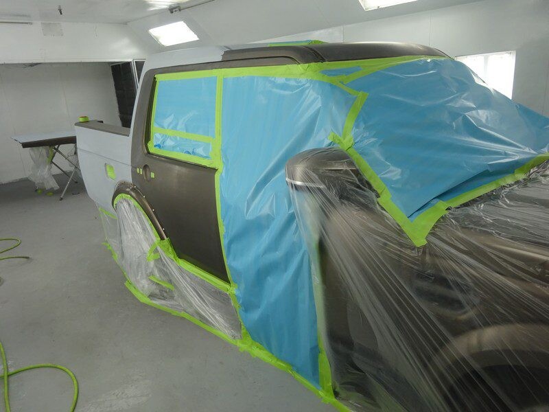 Car in auto body shop, prepped for paint.