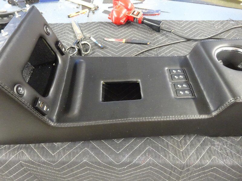 Custom car console with switches and USB.