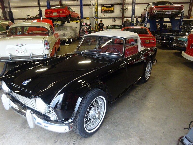Front three-quarter black TR3 showing red interior