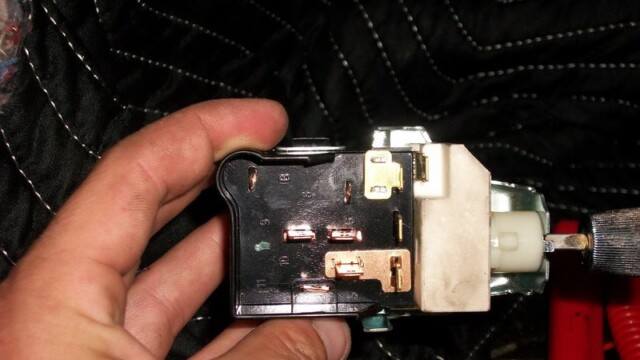 Disassembled car light switch closeup.