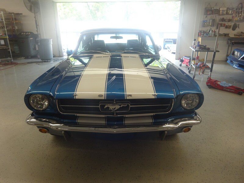 Blue Ford Mustang with racing stripes