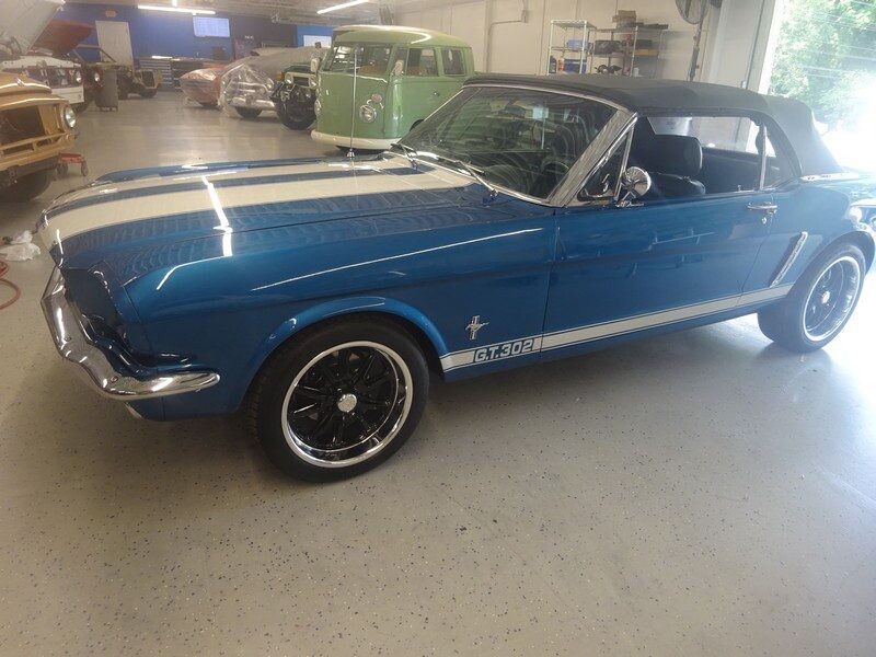 Blue Ford Mustang GT convertible.