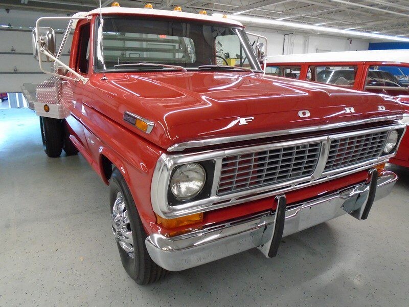 Red Ford F-series flatbed truck.