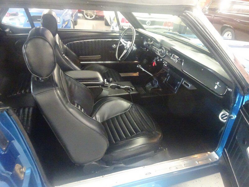 Black leather interior of a classic car.