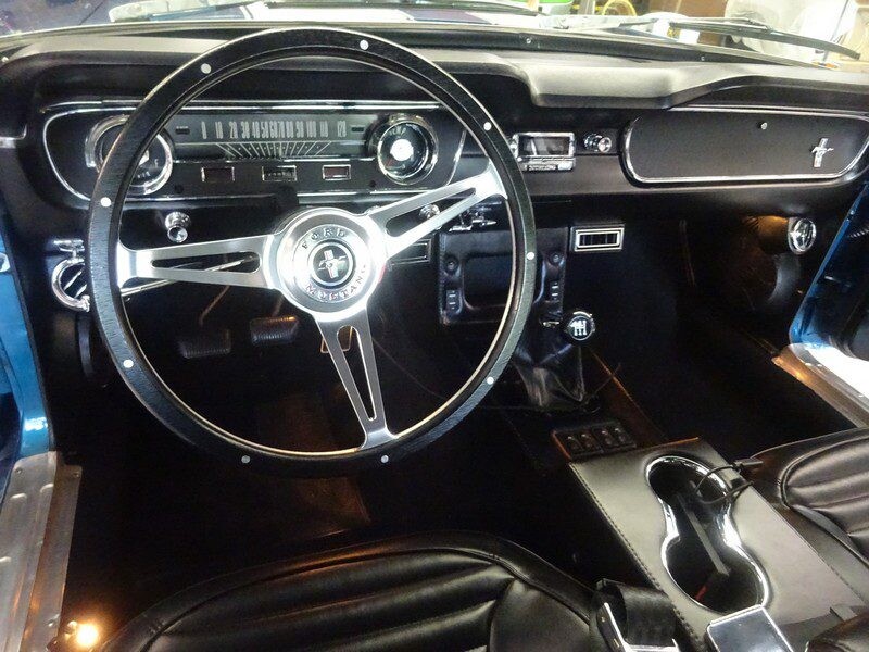 Classic Mustang interior, steering wheel, dashboard.