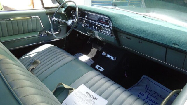 Green classic car interior dashboard.