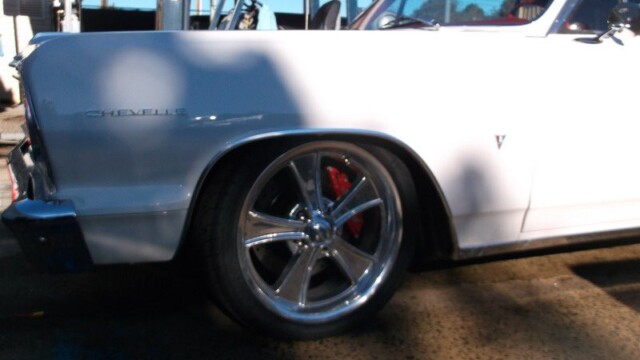 White Chevrolet Chevelle with custom wheels.