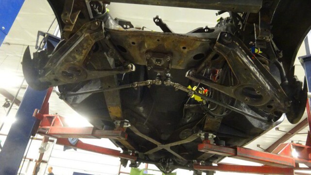 Car underside, suspension, restoration work.