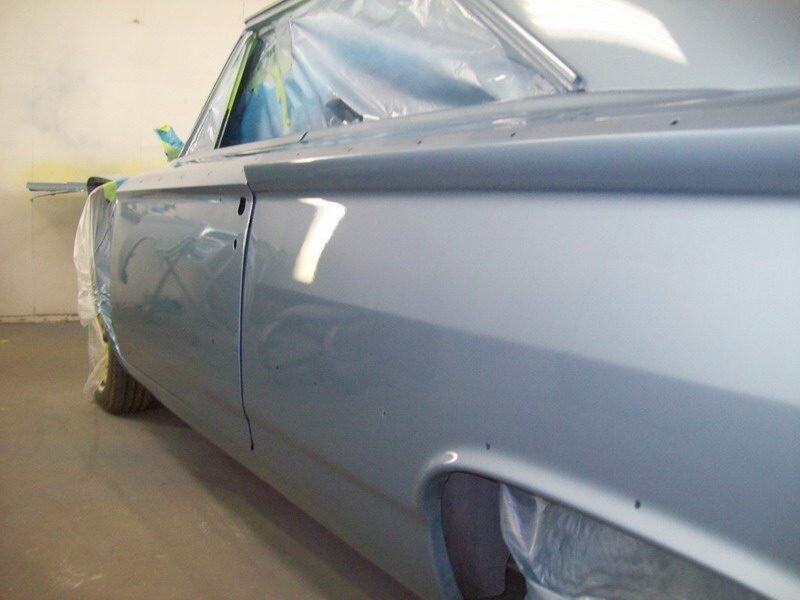 Light blue classic car, freshly painted.