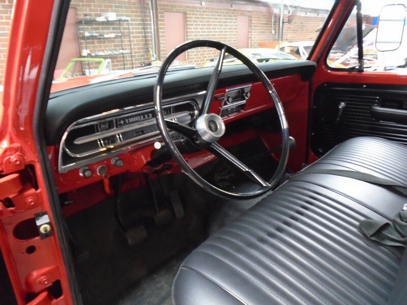 Red Ford truck interior, classic car.