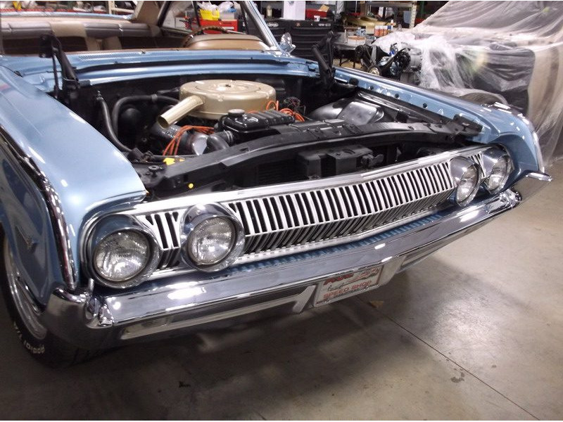 Light blue classic car engine detail.
