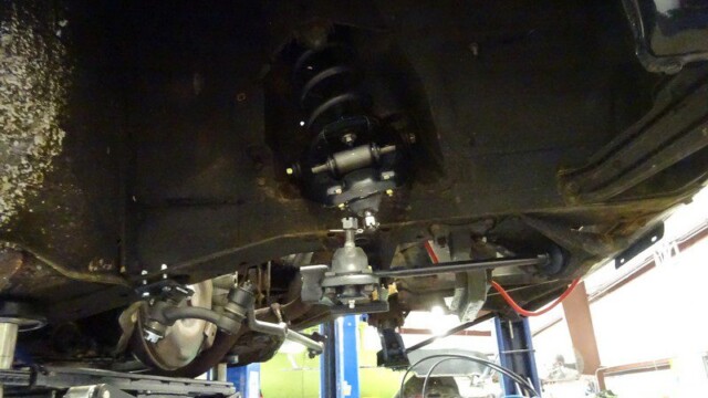 Car underside with suspension and steering components