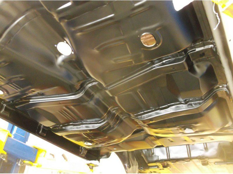Black painted car undercarriage.