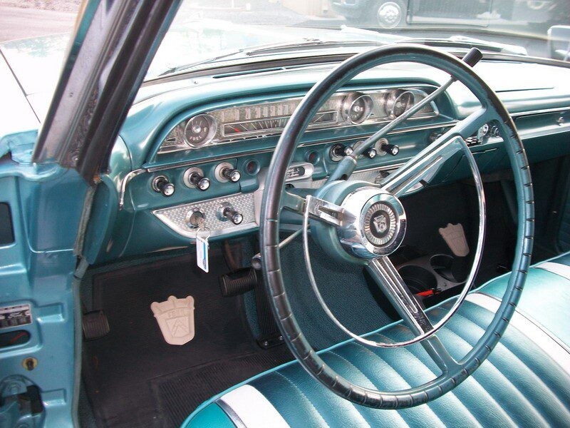 Here's an alt tag for the image: Vintage Ford car interior.