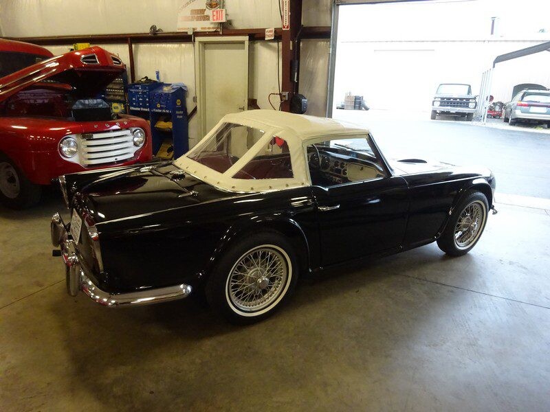 Rear three-quarter of black TR3 with wire wheels