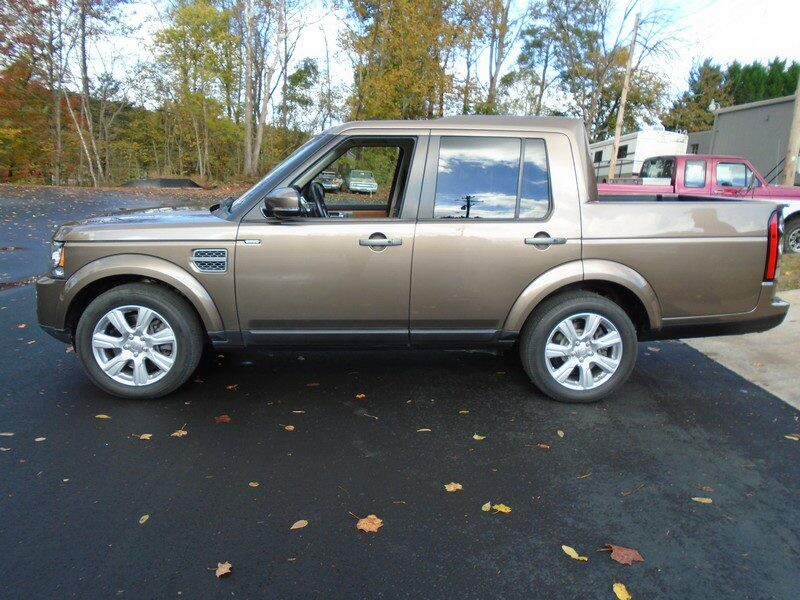 Brown Land Rover pickup truck.