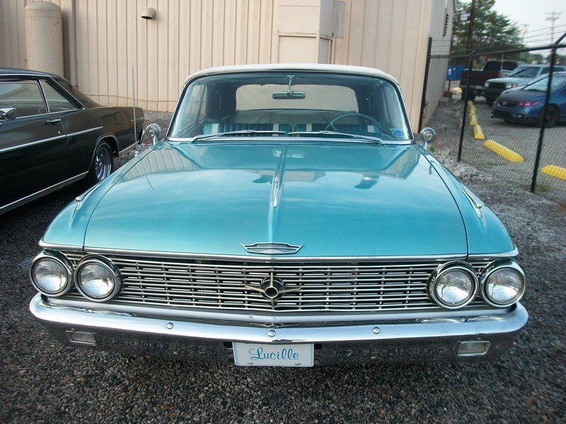 Vintage teal Ford Galaxie convertible.