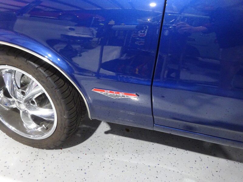 Here's an alt tag for the image: Blue Oldsmobile 442 GTO side profile.