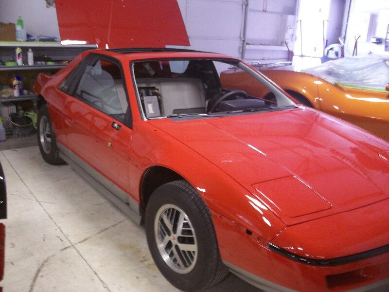 Red Pontiac Firebird Trans Am restoration.