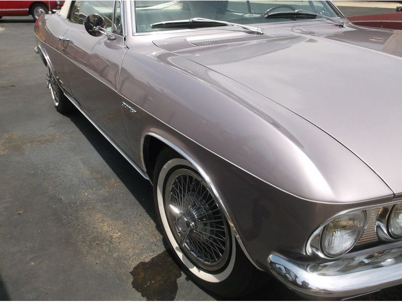 Silver classic car, side view.