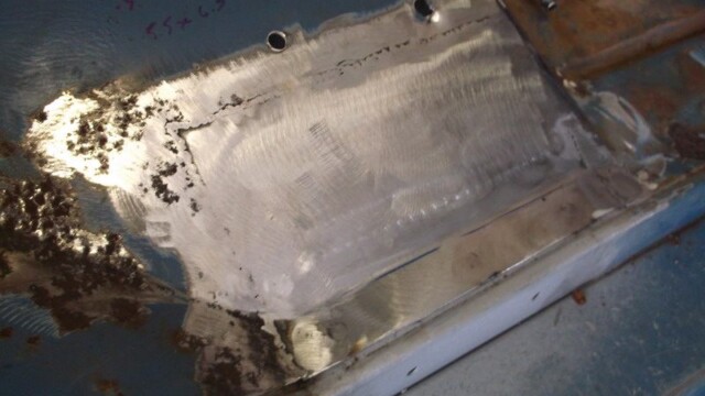 Car body panel repair in progress.
