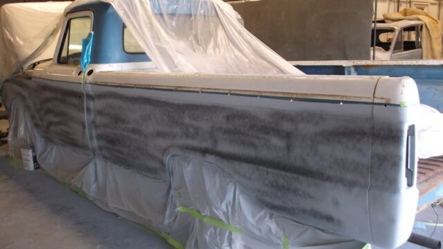 Primered vintage pickup truck body.